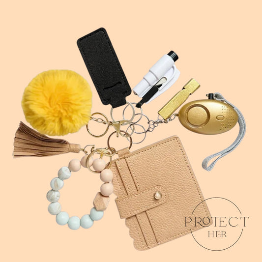 Collection of safety and self-defense items including a keychain with a tassel, pepper spray, and a wallet Protect Her
