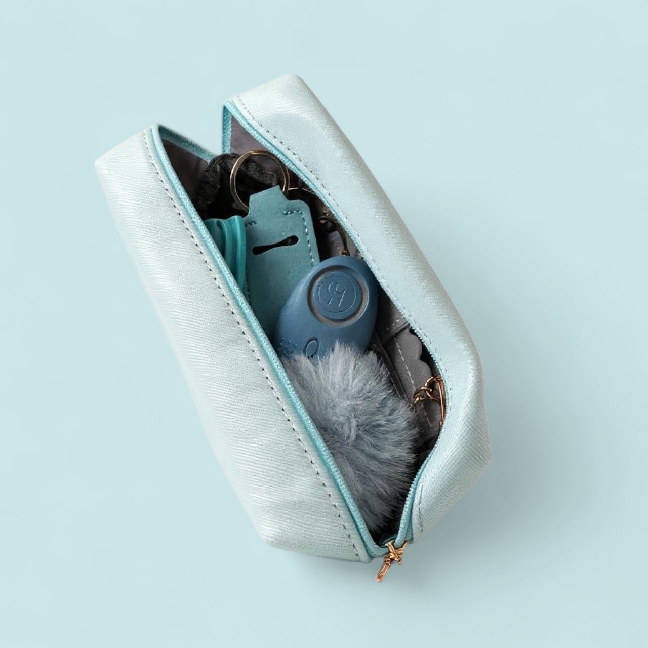 Blue pouch with wallet and a blue safety device