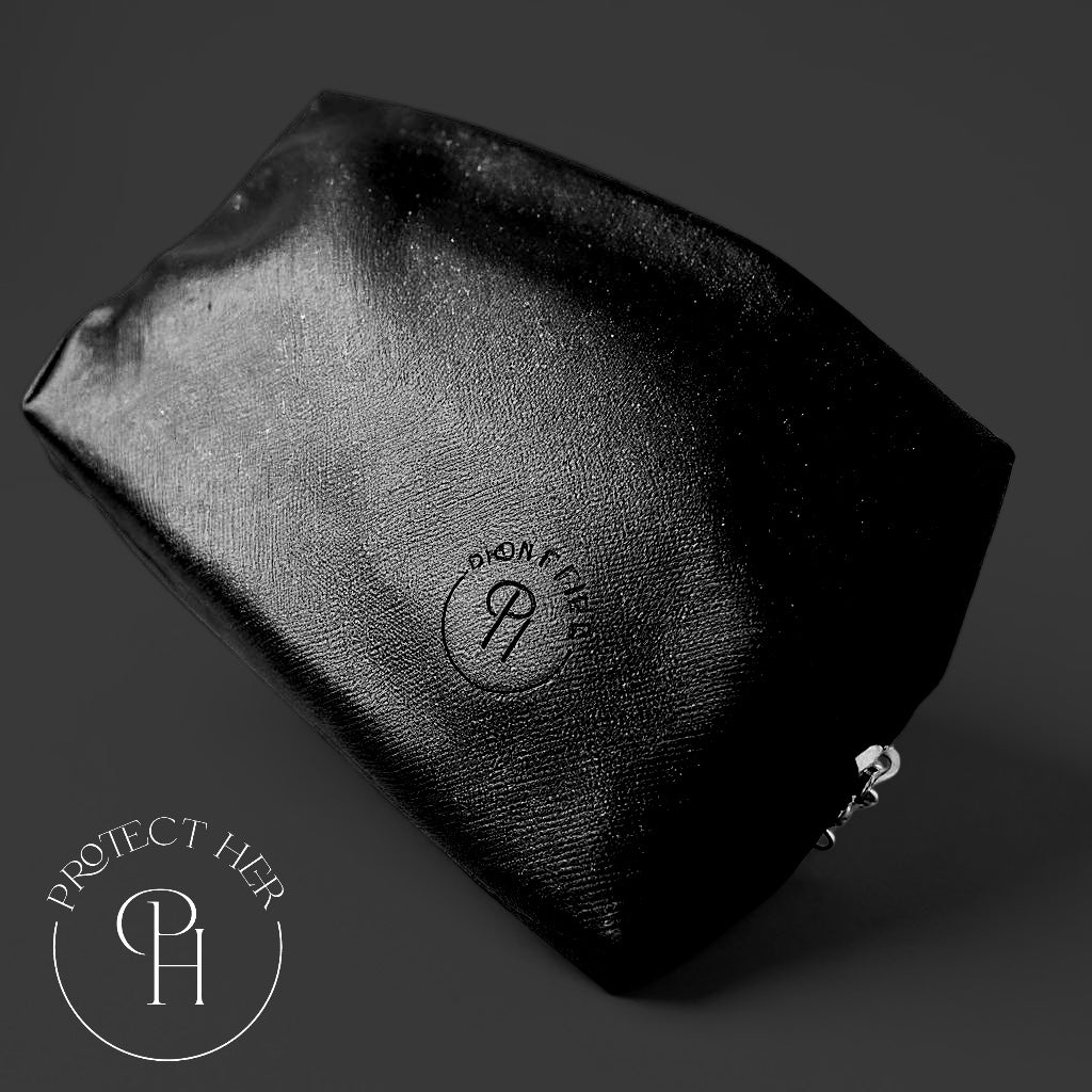 Black Protect Her Bundle pouch with a brand logo on a dark background