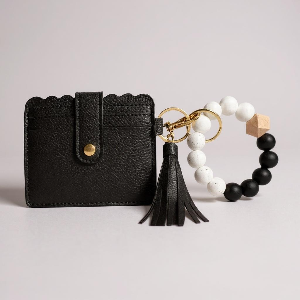Black wallet with tassel, keychain, and beaded bracelet