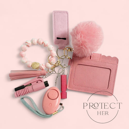 Collection of pink safety and accessory items  with 'PROTECT HER' 